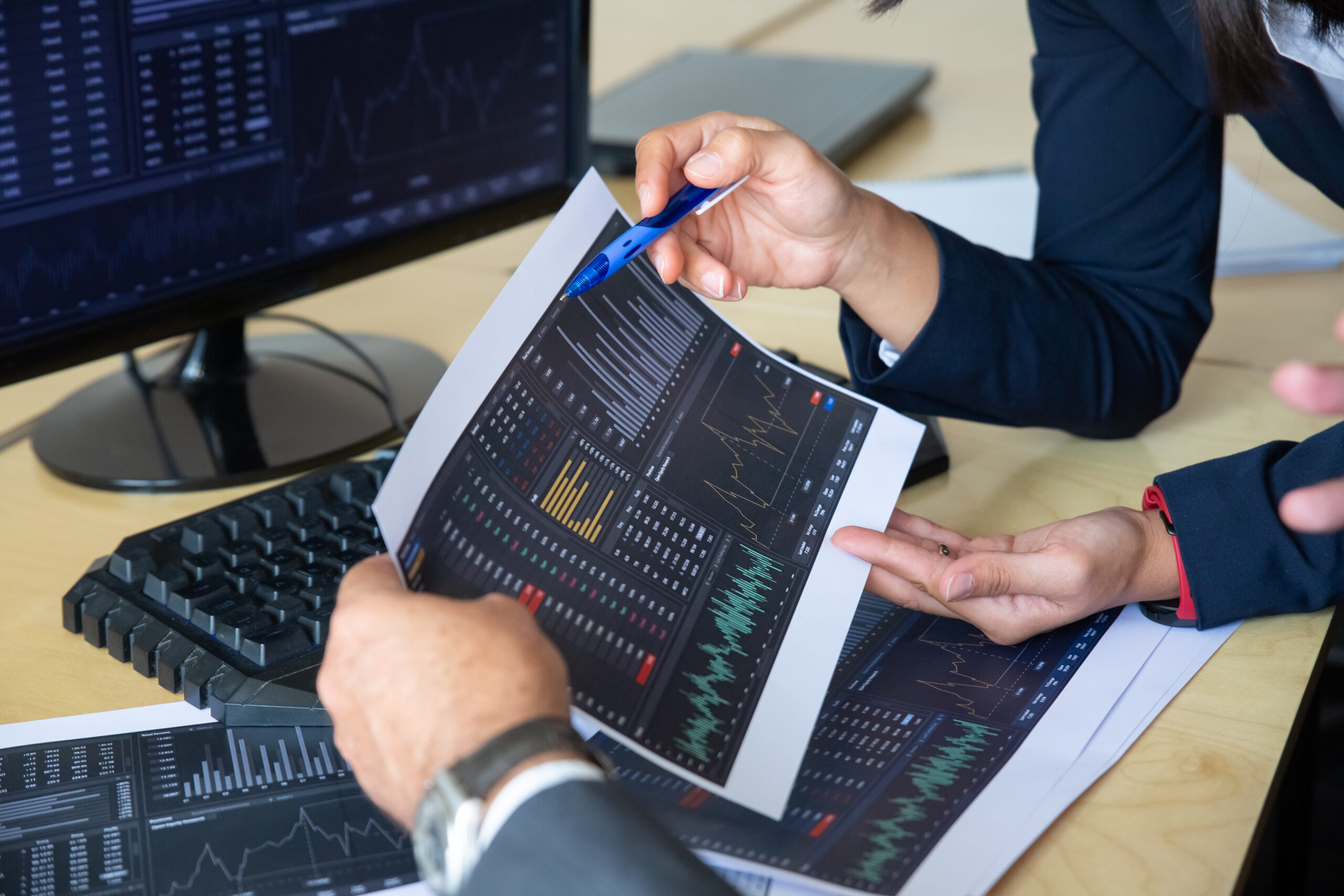 brokers discussing trading strategy