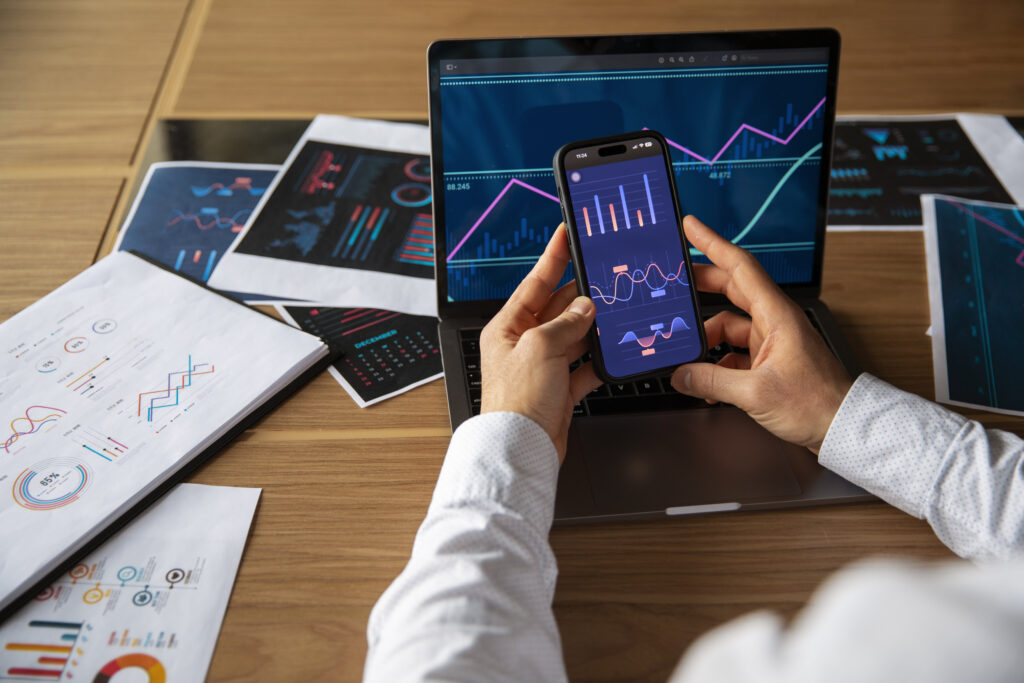 office workers using finance graphs