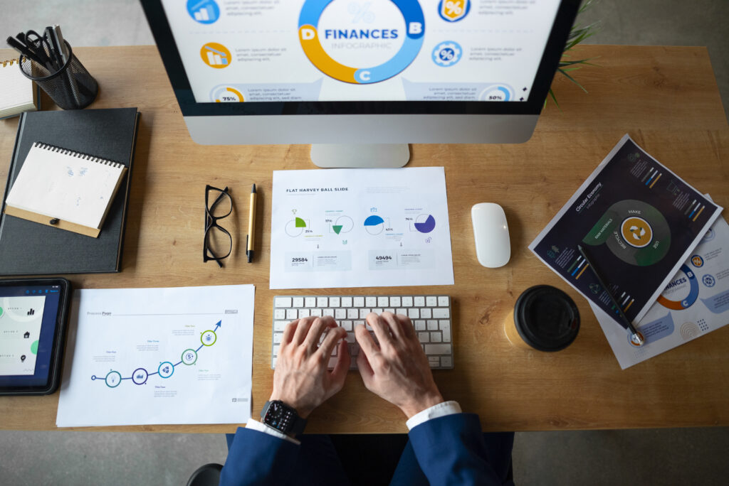 person office analyzing checking finance graphs