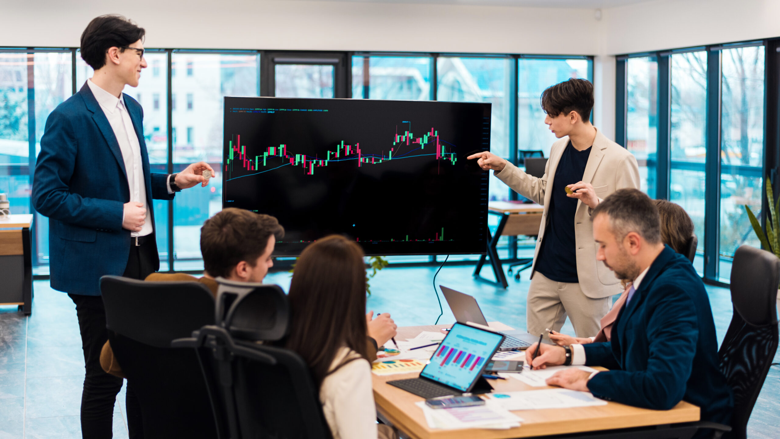 two young worker leading business meeting about cryptocurrencies in an office